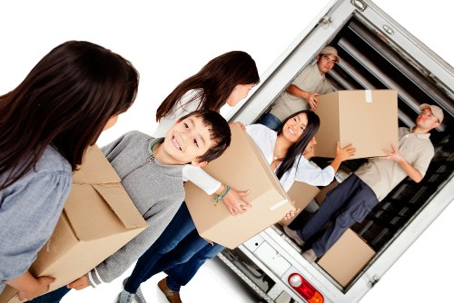 Professional movers assisting with home relocation in Manandvan Merton