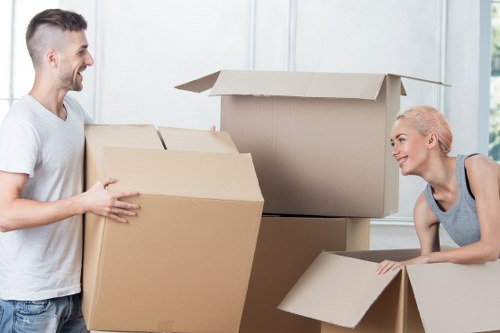 Experienced team of movers handling furniture and boxes